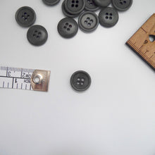 Load image into Gallery viewer, Corozo button with 4 holes, displayed amongst tape measure and ruler