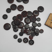 Load image into Gallery viewer, Scattering of 4-hole corozo buttons in three different sizes