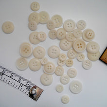 Load image into Gallery viewer, Scattering of 4-hole corozo buttons in three different size