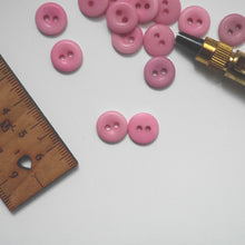 Load image into Gallery viewer, Two 2-hole corozo buttons, one showing smooth dome side, the other showing concave side