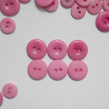 Load image into Gallery viewer, Larger 2-hole corozo buttons shows the smooth side and the concave side
