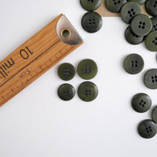 Load image into Gallery viewer, Four 4-hole buttons in 2 different sizes, shows one flat side, and one domed side