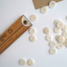 Load image into Gallery viewer, Two 4-hole buttons displayed, one with flat side, the other domed