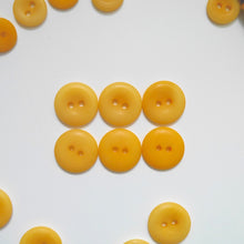 Load image into Gallery viewer, Larger size 2-hole buttons showing the concave side, and the smooth dome side