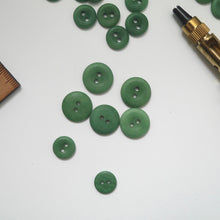 Load image into Gallery viewer, Larger size 2-hole corozo buttons, shows the smooth dome side, and the concave side