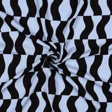 Load image into Gallery viewer, Eco Viscose fabric with graphic pattern, displayed with central swirl to show drape