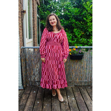 Load image into Gallery viewer, Model wears a long dress, made with Stripes Eco Viscose Fabric