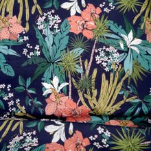 Load image into Gallery viewer, Navy blue cotton lawn fabric with colourful floral and leaf pattern displayed with drape