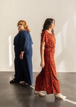 Load image into Gallery viewer, Two ladies wearing Avenir Jumpsuit walking away from one another
