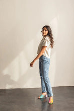 Load image into Gallery viewer, Side view of lady standing wearing a short sleeve Donny shirt