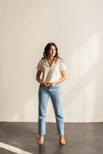 Load image into Gallery viewer, Lady stands wearing a deep V-neck open collar short sleeve Donny shirt