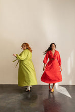 Load image into Gallery viewer, Two ladies mid-spin wearing the Saturday Skirt Set wrap top and midi skirt