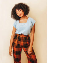 Load image into Gallery viewer, Lady stands wearing a square neck top, tucked into trousers