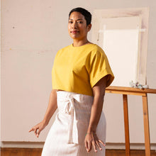 Load image into Gallery viewer, Lady wears a cropped shirt with fold up short sleeves, with tie waist skirt