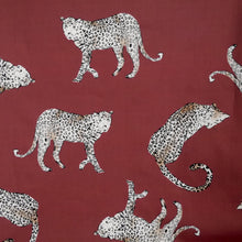 Load image into Gallery viewer, Flat lay of cotton fabric with prints of leopards on the prowl