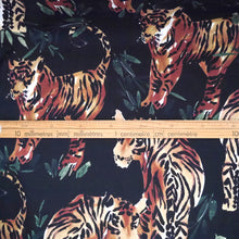 Load image into Gallery viewer, Watercolour Tigers printed on a plain backdrop on cotton fabric, with ruler underneath a tiger