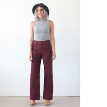 Load image into Gallery viewer, Lady wears The Lander Pant from True Bias, bootcut, highwaisted with visible button fly, and side patch pockets