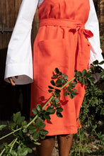 Load image into Gallery viewer, Close up shot of apron dress with large patch pockets at front