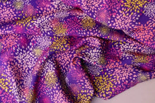 Load image into Gallery viewer, Artifice viscose fabric of fireworks print slightly crumpled on table