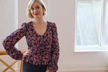 Load image into Gallery viewer, Lady wears a v-neck blouse made up in Pashmina Viscose floral print fabric