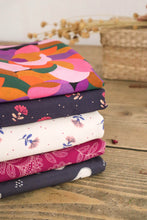Load image into Gallery viewer, A pile of Lise Tailor fabrics folded with the Fairytale print on the top
