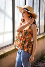 Load image into Gallery viewer, Lady looks out the window wearing a strappy vest, made up in the Opulence Viscose fabric, worn with jeans.