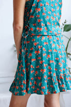 Load image into Gallery viewer, Back view of short skirt with a gathered hem, made up with the Evergreen Viscose fabric