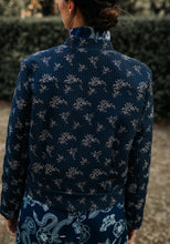 Load image into Gallery viewer, Back view of lady wearing Dandelion Jacket, with a stand collar and back yoke