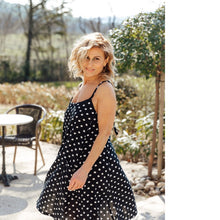 Load image into Gallery viewer, Lady mid-spin wears a Paola Dress, a strappy dress with flared skirt