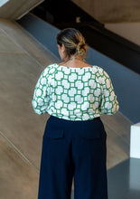 Load image into Gallery viewer, Back view of lady wearing Brooklyn trousers showing pockets with flaps
