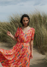 Load image into Gallery viewer, Lady wears a V-neck, short-sleeve dress with elasticated waist