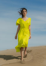 Load image into Gallery viewer, Lady wears a V-neck, short-sleeve dress with elasticated waist
