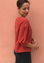 Load image into Gallery viewer, Side View of lady wearing Niki Blouse showing off inverted pleat sleeve detail