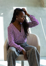 Load image into Gallery viewer, Lady wears a Wrap Blouse in a geometric pattern print