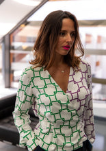 Load image into Gallery viewer, Lady wears a long sleeved wrap blouse in different colour fabric panels