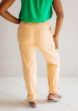 Load image into Gallery viewer, Back view of lady wearing Tremplin Trouser cargo pants, worn with flat sandals. Two patch pockets at back.