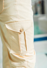 Load image into Gallery viewer, Close up detail of Tremplin Trousers side pocket, patch with pleats and flap detail