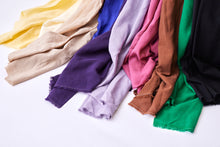 Load image into Gallery viewer, Selvedge ends of different colours of Vida Voile Fabrics drape along the floor