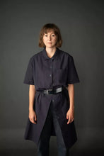 Load image into Gallery viewer, Model wears collared, box-fit, short-sleeved shirt-dress with patch pocket at chest