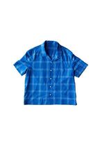 Load image into Gallery viewer, Flat lay of boxy short-sleeve shirt on top of a contrasting colour background