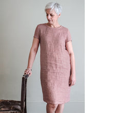 Load image into Gallery viewer, Lady stands by a chair wearing a Camber Set Dress, t-shirt dress, knee length