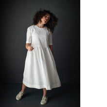 Load image into Gallery viewer, Lady wears the Ellis & Hattie Dress, with elbow length sleeves