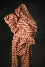 Load image into Gallery viewer, Bolt of geometric pattern handblock, organic cotton fabric stood upright with fabric draped on itself