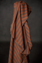 Load image into Gallery viewer, Bolt of upright striped fabric, draped over itself