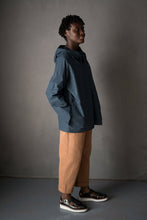 Load image into Gallery viewer, Lady wears cropped, tapered trousers with sandals, and an overcoat