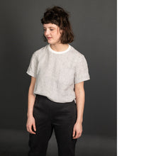 Load image into Gallery viewer, Lady wears a Tee Shirt with a stripe pattern and plain neckline, tucked into trousers