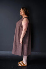 Load image into Gallery viewer, Side view of model wearing Trapeze dress: a sleeveless flared dress