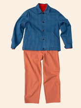 Load image into Gallery viewer, Buttoned-up Chore Jacket displayed flat with a pair of trousers on a plain background