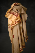 Load image into Gallery viewer, Organic cotton fabric with spot print crumpled on top of its bolt