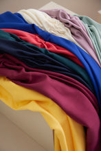 Load image into Gallery viewer, EcoVero Viscose Leia Crepe Fabrics in different colours lays crumpled up next to each other